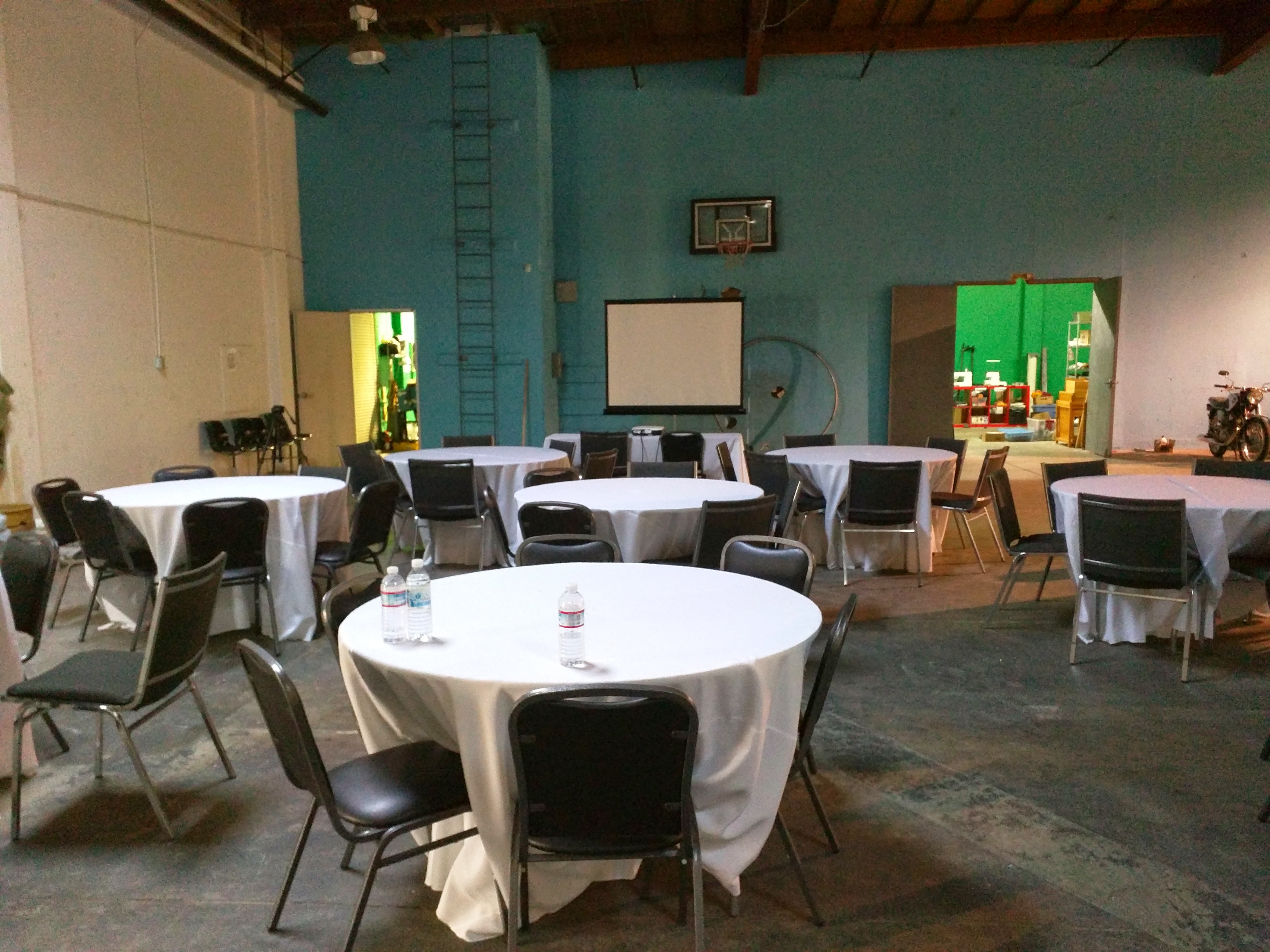 Refactor Camp 2015 venue with round tables set up for sessions