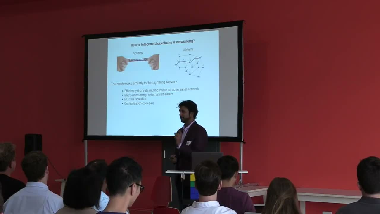 Refactor Camp 2018 Day 2, speaker presenting blockchain networking talk