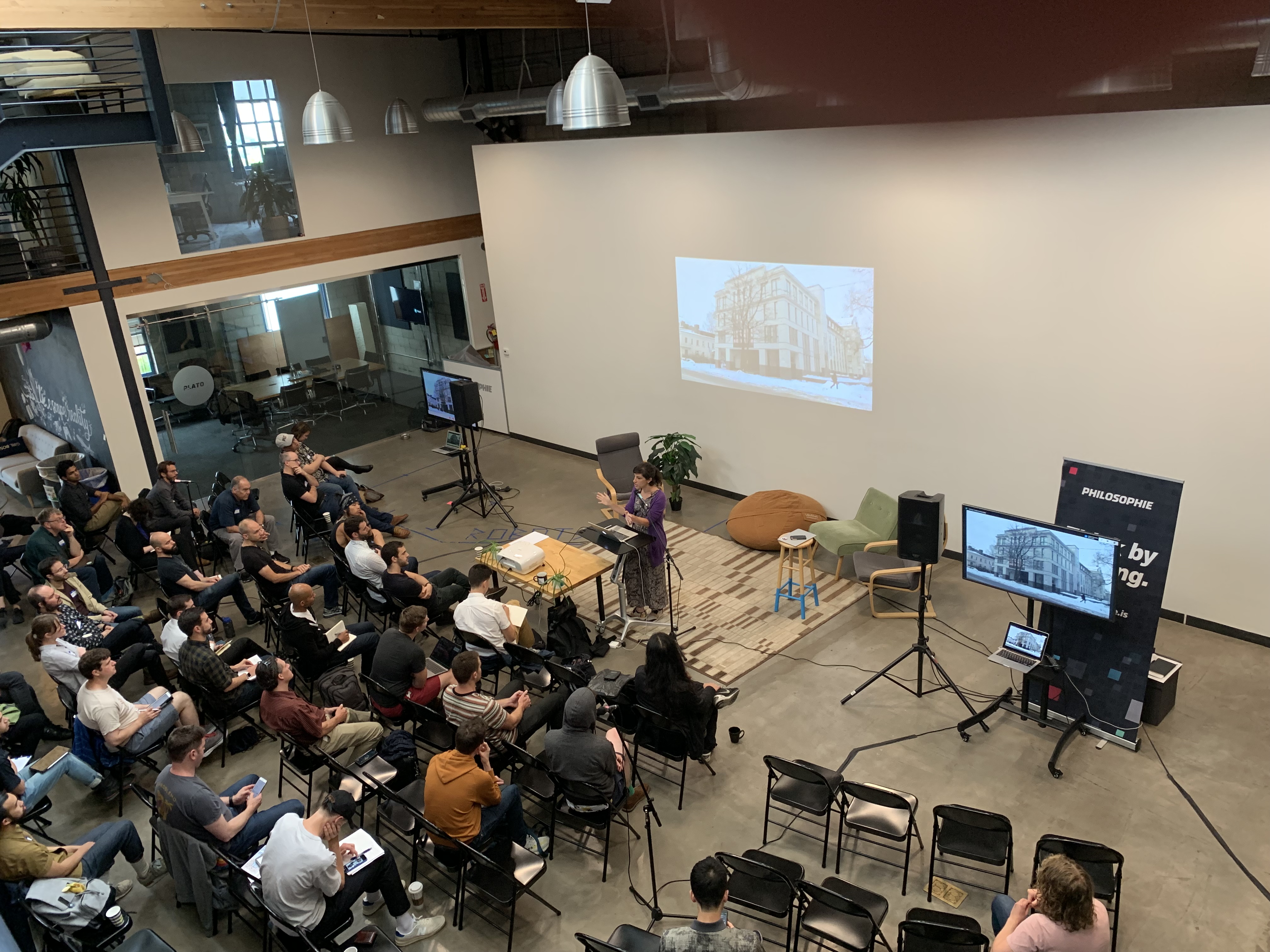Refactor Camp 2019 aerial view from mezzanine, speaker and audience below